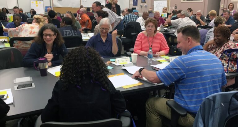 Participants in “A Project Management Framework for HM Disaster Functions,” a training course delivered by the University of Maryland, work through group assessment activities. Photo by Don Bouchard.