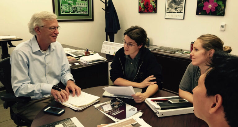 Dr. Berke meets with students.