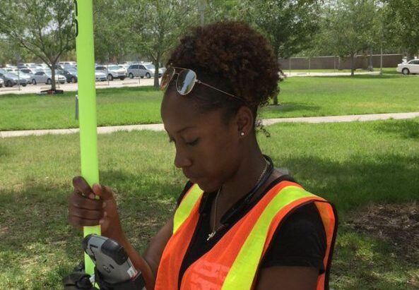 Sabrina Welch of Jackson State University learns about surveying at the University of Central Florida as part of the CRC's SUMREX program. Photo by Dr. Stephen Medeiros.