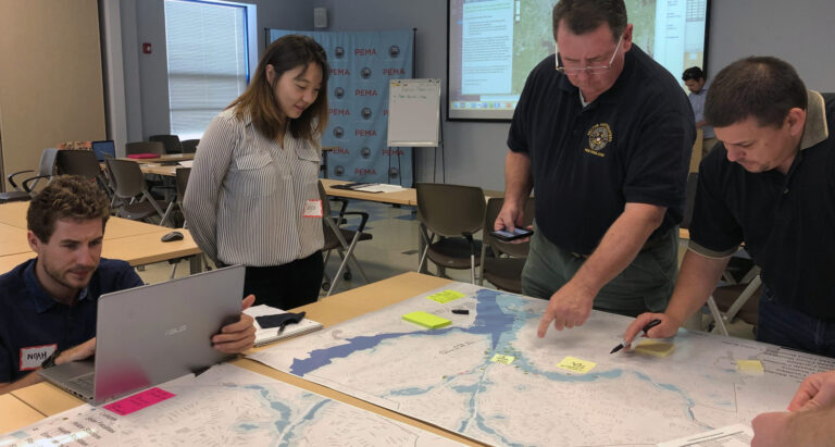 Representatives of Rhode Island emergency management agencies, along with government and public health departments met with University of Rhode Island researchers for training exercises this summer. Photo submitted.