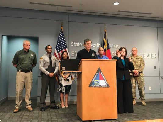 North Carolina Gov. Roy Cooper gives an update on the state’s preparations for Hurricane Florence in Sept. 2018. Photo by Sam DeGrave/Asheville Citizen-Times.